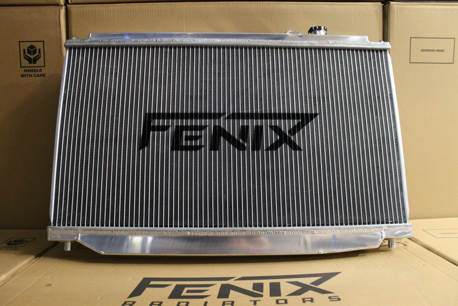 Toyota Supra JZA80 Full Alloy Performance Radiator & Fan Shroud Kit – polished radiator Fenix core logo view – original Fenix photograph