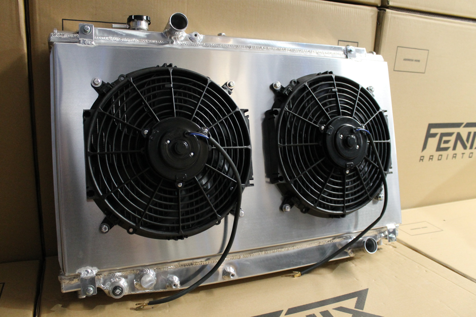 Toyota Supra JZA80 Full Alloy Performance Radiator & Fan Shroud Kit – polished radiator and twin fan kit angled view – original Fenix photograph