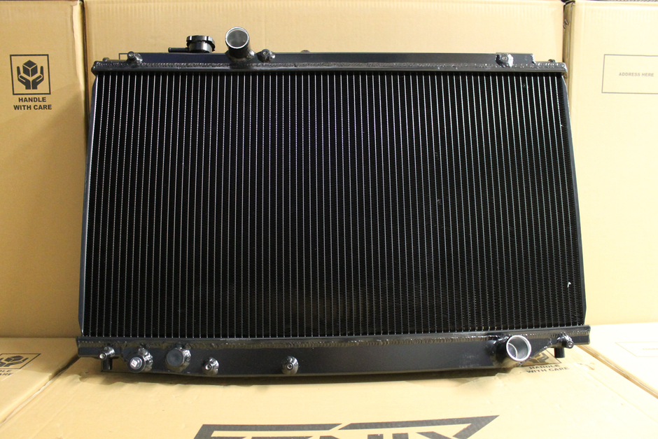 Toyota Supra JZA80 Full Alloy Performance Radiator & Fan Shroud Kit – satin black radiator reverse view – original Fenix photograph