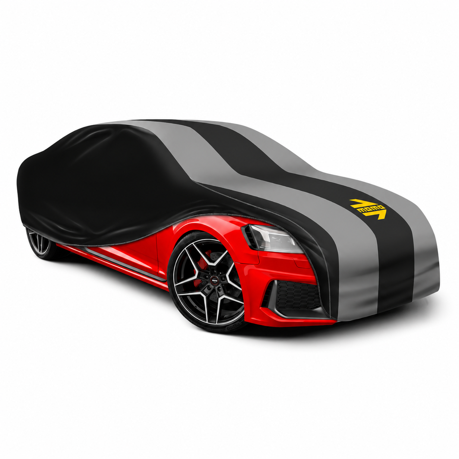MOMO Shield black and grey car cover with yellow MOMO logo, shown on a car against a white background